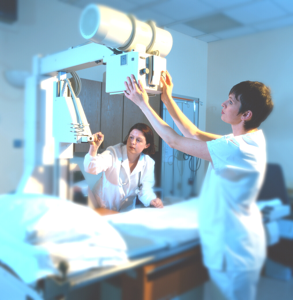view of x-ray technicians operating an x-ray machine